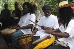 Kanjah Sweeney (from left), Kayan Payne and Kemit Sweeney drum at the beginning of the prayer meeting.